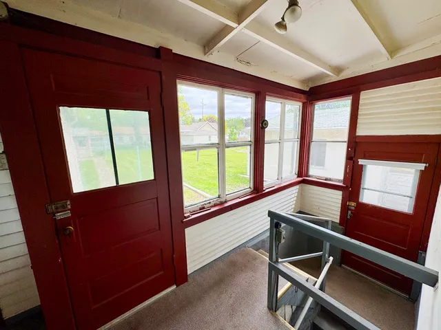 a living room with large windows