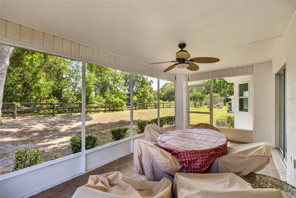 6032 Southwest 103rd Loop Ocala, FL 34476 - Photo 21 of 28 a living room with couch large window