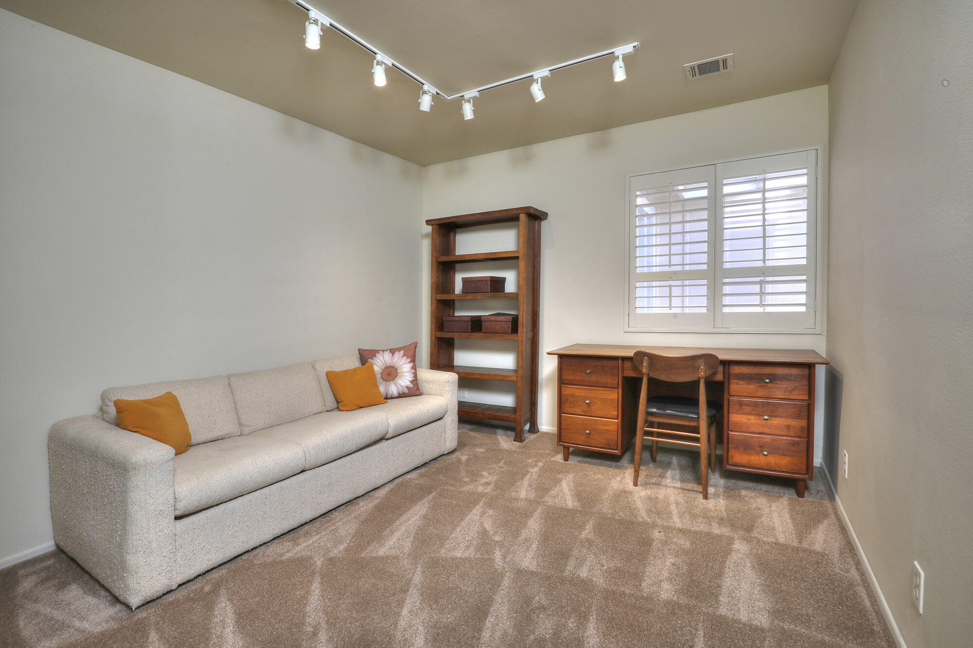 6061 Berkeley Road Goleta, CA 93117 - Photo 12 of 23 a living room with furniture and a window