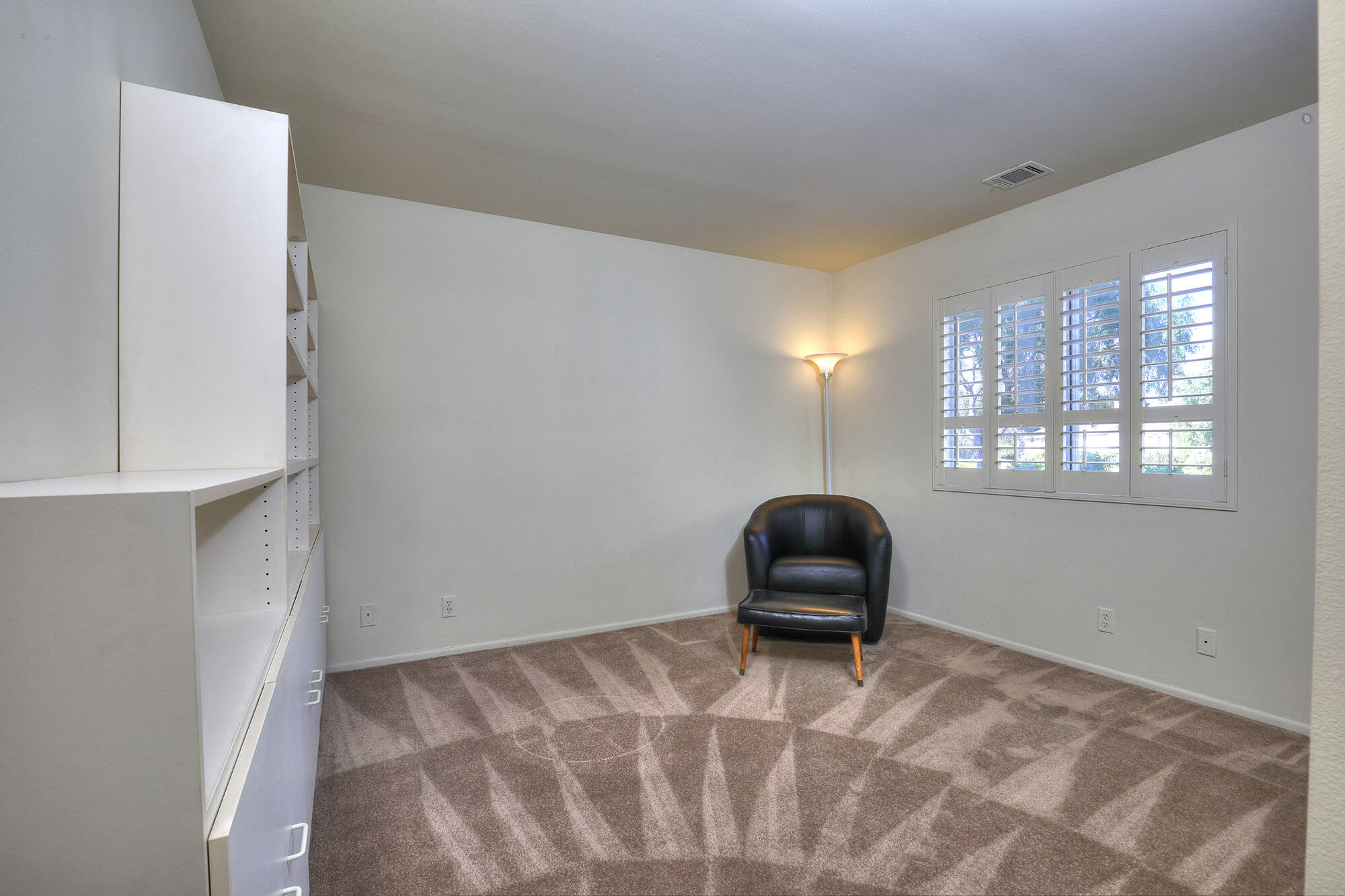 6061 Berkeley Road Goleta, CA 93117 - Photo 15 of 23 a bedroom with a bed and a chair