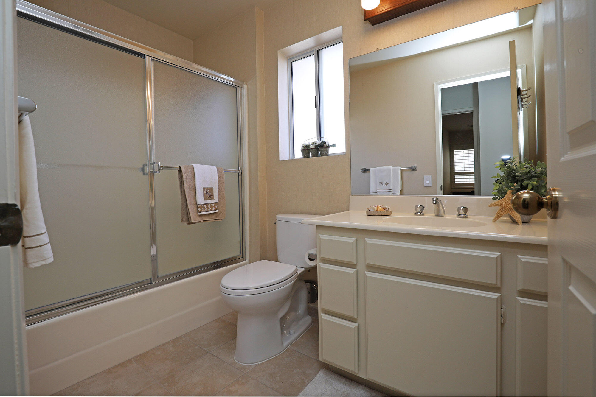 6061 Berkeley Road Goleta, CA 93117 - Photo 18 of 23 a bathroom with a sink toilet and shower