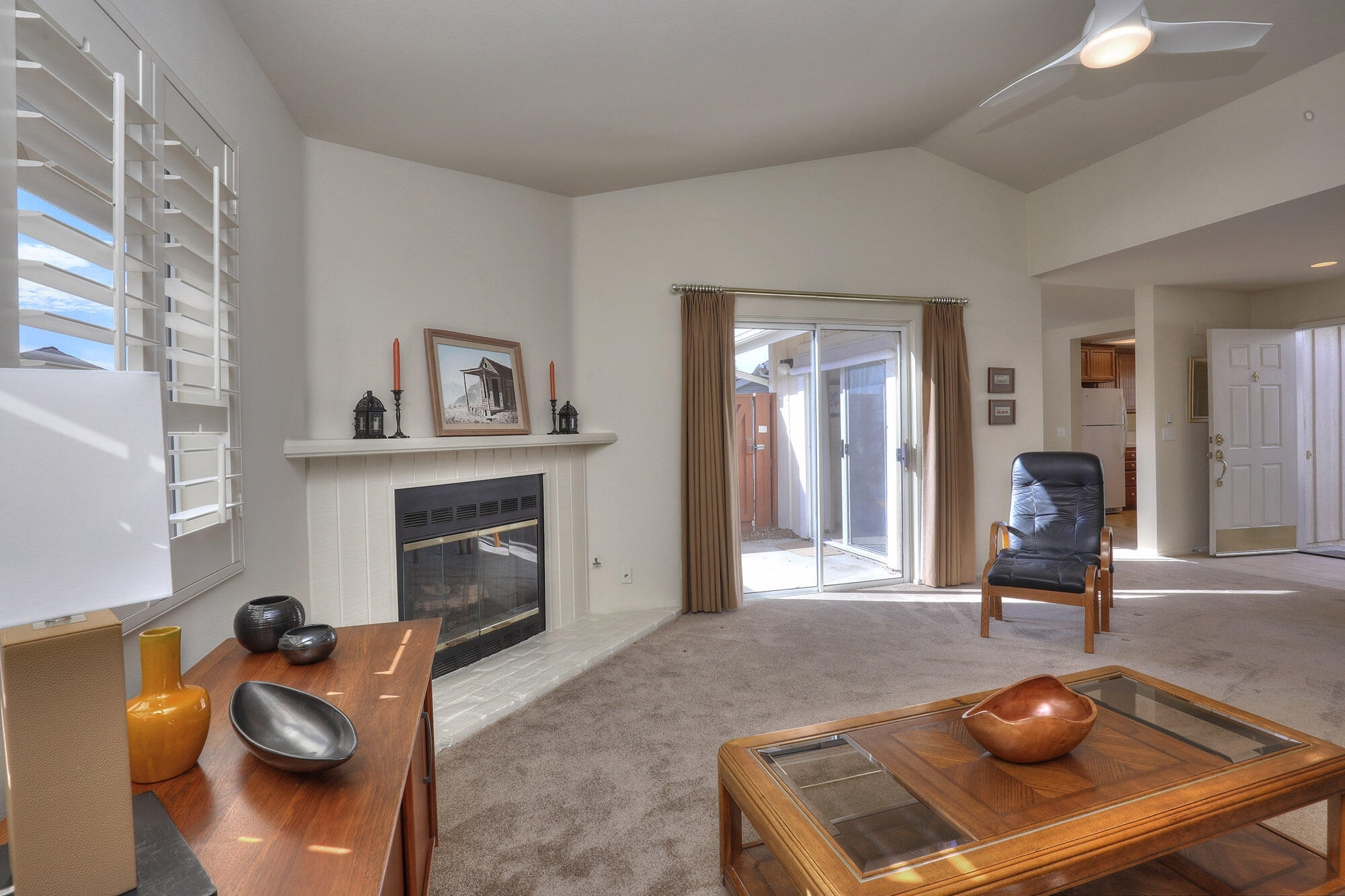 6061 Berkeley Road Goleta, CA 93117 - Photo 3 of 23 a living room with furniture and a fireplace