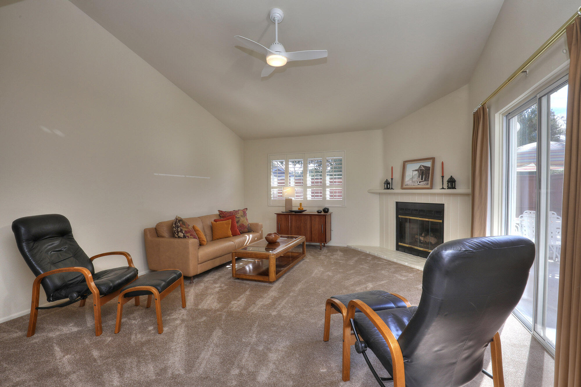 6061 Berkeley Road Goleta, CA 93117 - Photo 5 of 23 a living room with furniture a fireplace and a window