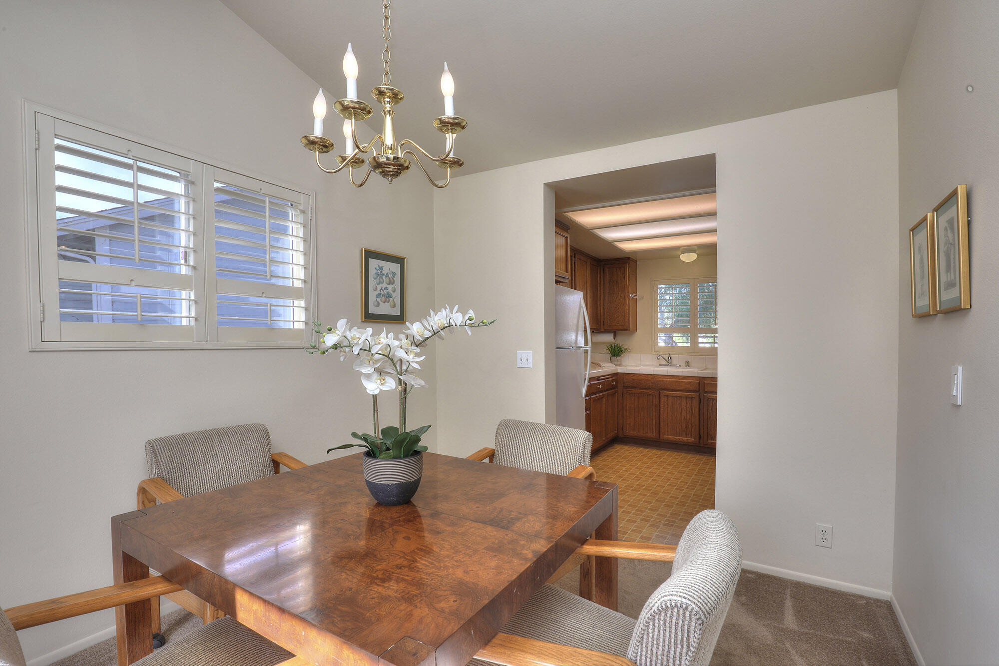 6061 Berkeley Road Goleta, CA 93117 - Photo 7 of 23 a dining room with chandelier and wooden floor