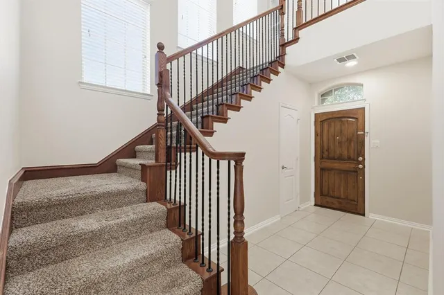 a view of entryway and hall with a rug