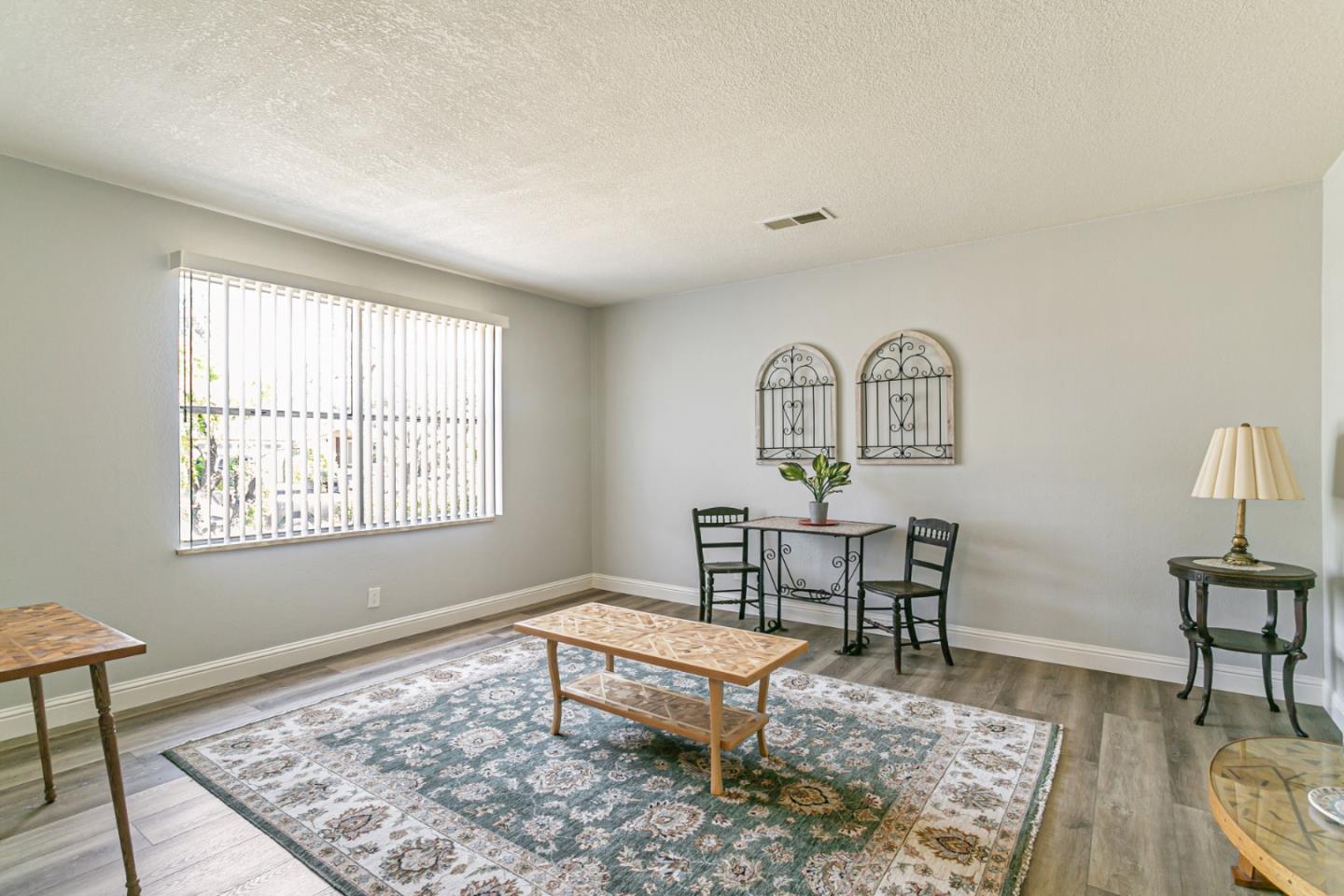 970 Ortega Circle Gilroy, CA 95020 - Photo 11 of 26 a living room with a couch and a table in it