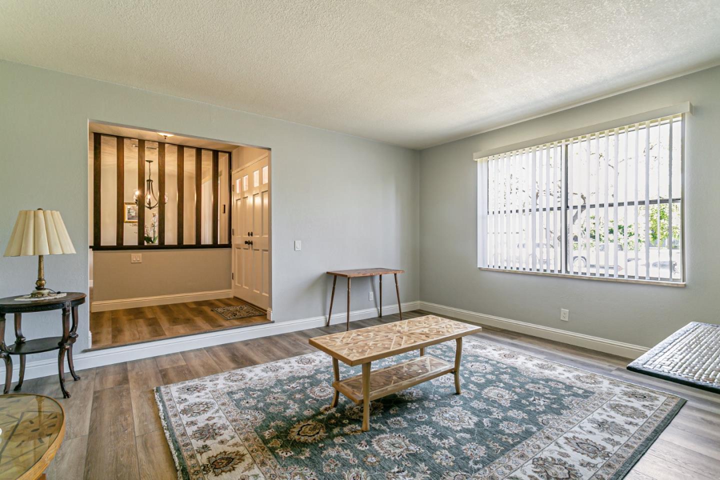 970 Ortega Circle Gilroy, CA 95020 - Photo 13 of 26 a living room with a couch and a rug