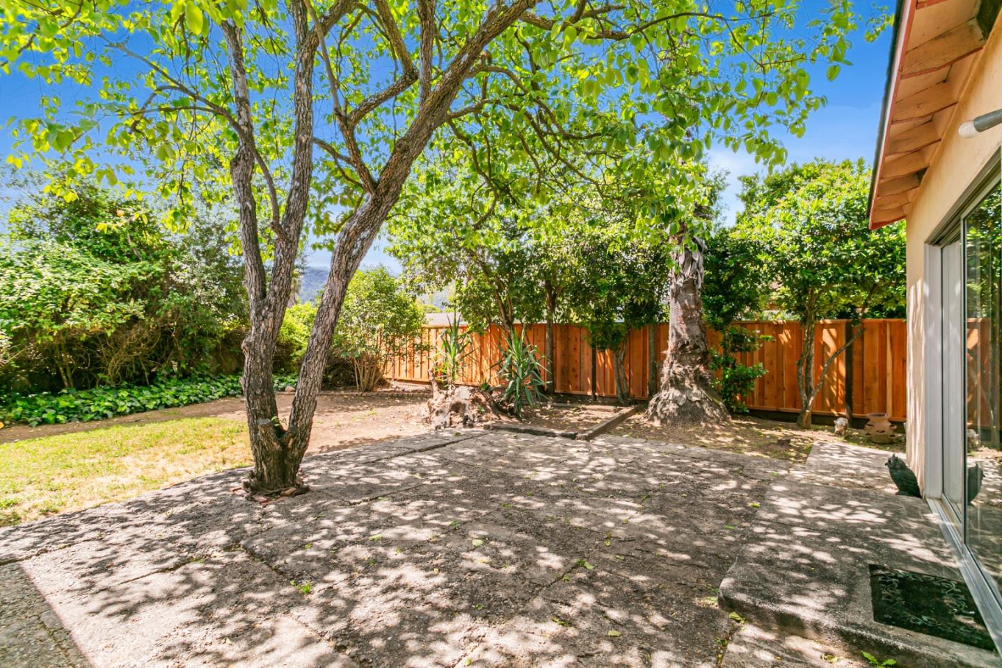 970 Ortega Circle Gilroy, CA 95020 - Photo 26 of 26 a backyard of a house with table and chairs