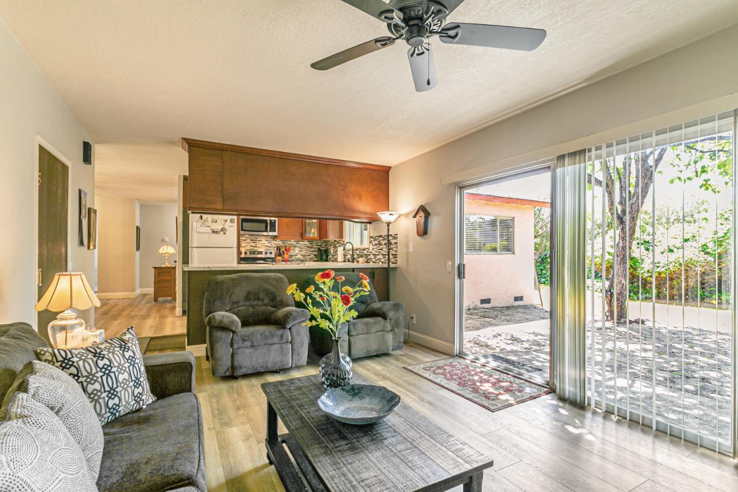 970 Ortega Circle Gilroy, CA 95020 - Photo 3 of 26 a living room with furniture and a floor to ceiling window
