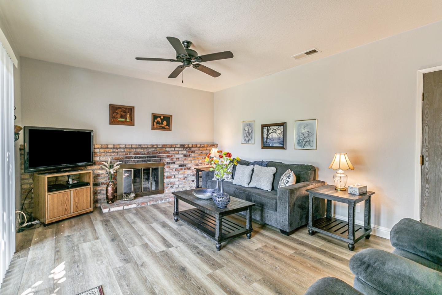 970 Ortega Circle Gilroy, CA 95020 - Photo 5 of 26 a living room with furniture and a flat screen tv