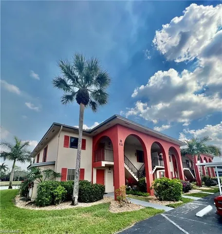 a front view of a house with yard