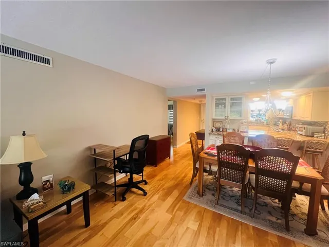 a very nice looking dining room with furniture