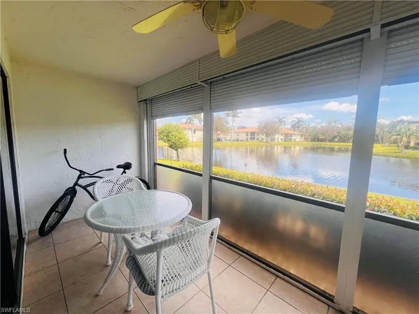 a view of a swimming pool with a yard