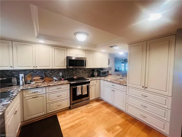 a living room with furniture rug and window