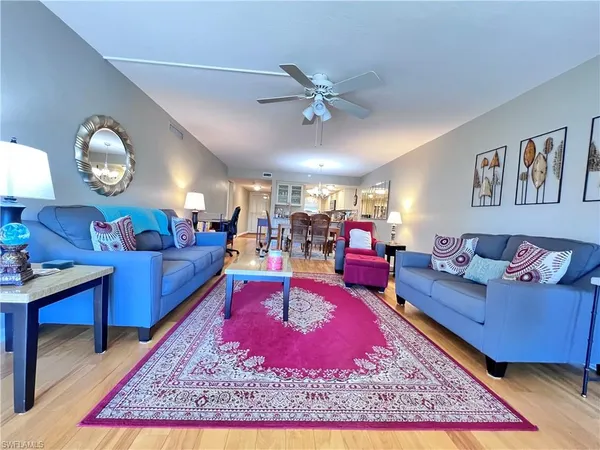 a living room with furniture or couch and a flat screen tv