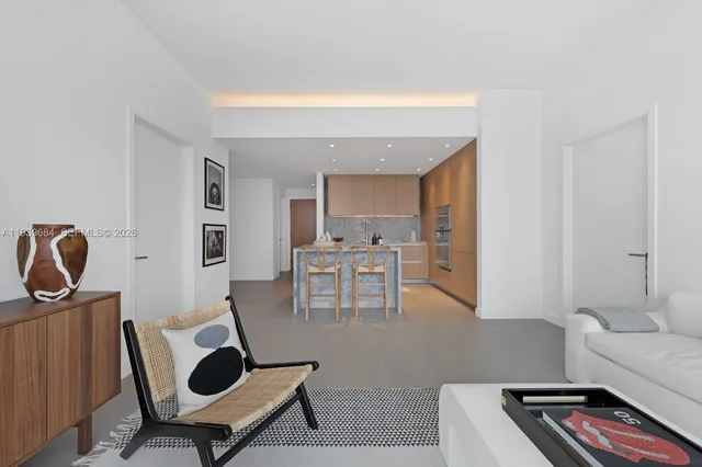 a living room with furniture and a chair