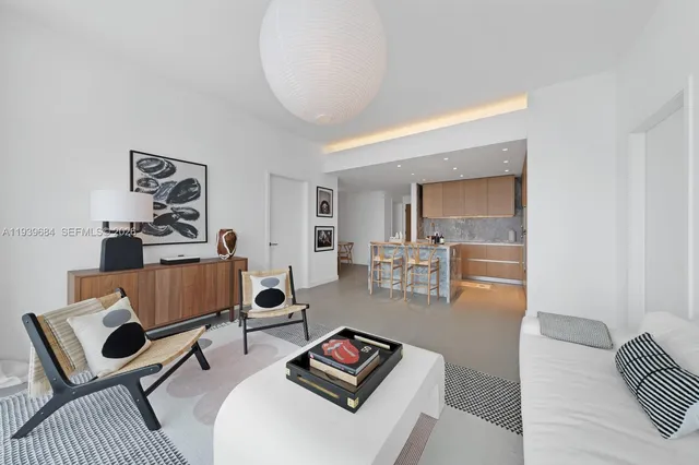 a living room with furniture and a rug