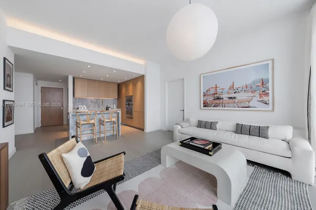 a living room with furniture and a rug