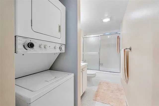 a view of bathroom with a washer and dryer