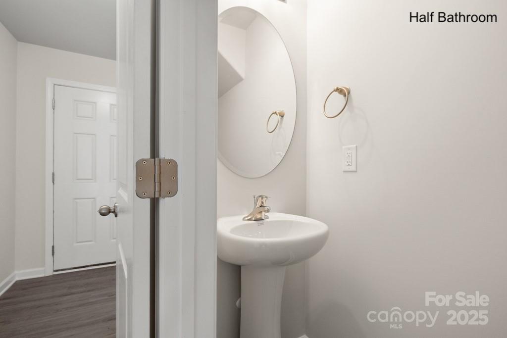 319 Connor Street Lancaster, SC 29720 - Photo 14 of 47 a bathroom with a sink and mirror