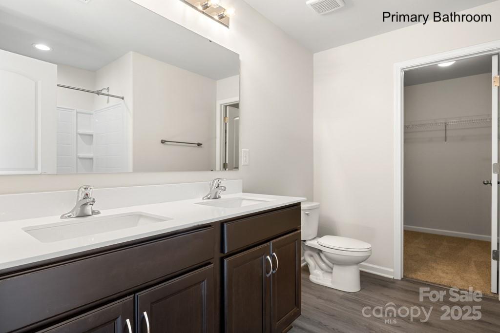 319 Connor Street Lancaster, SC 29720 - Photo 17 of 47 a bathroom with a sink a toilet and a mirror