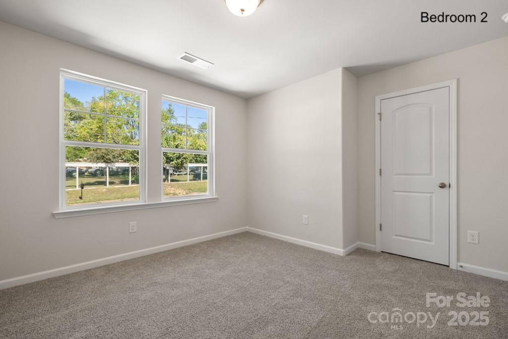 319 Connor Street Lancaster, SC 29720 - Photo 20 of 47 an empty room with windows