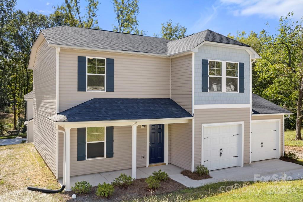 319 Connor Street Lancaster, SC 29720 - Photo 2 of 47 a front view of a house with garden