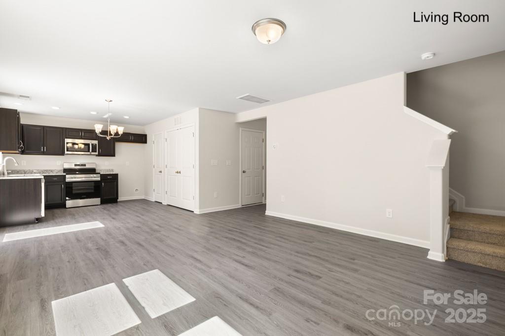 319 Connor Street Lancaster, SC 29720 - Photo 8 of 47 a view of a kitchen with wooden floor