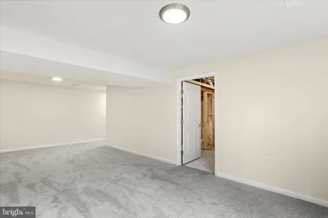 an empty room with closet area