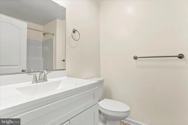 a bathroom with a sink toilet and vanity