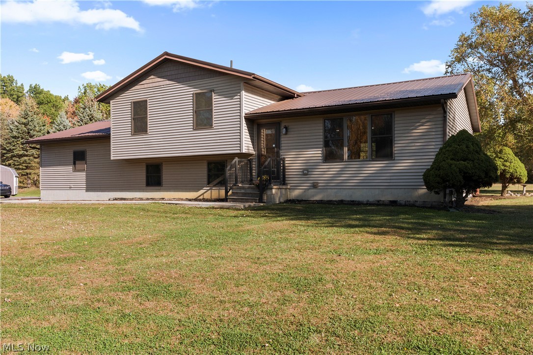6760 Mason Road Berlin Heights, OH 44814 - Photo 37 of 49 Tri-level home with a metal roof and a front lawn