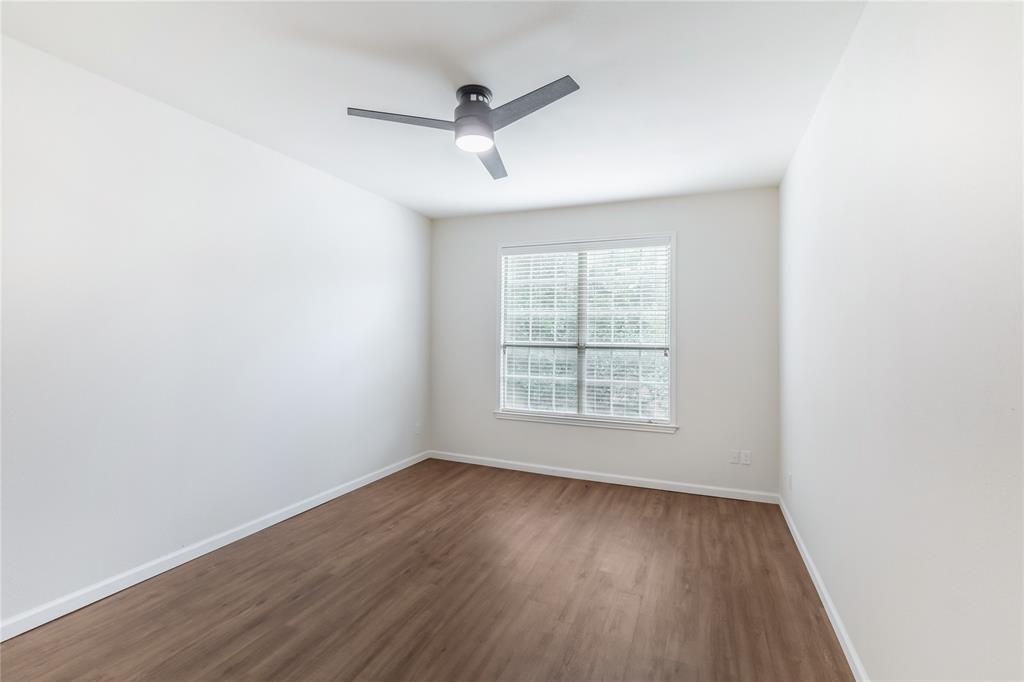 12680 Hillcrest Road, Unit 4101 Dallas, TX 75230 - Photo 24 of 37 Room featuring wood-finish flooring, a contemporary ceiling fan with integrated lighting, and a window with horizontal blinds