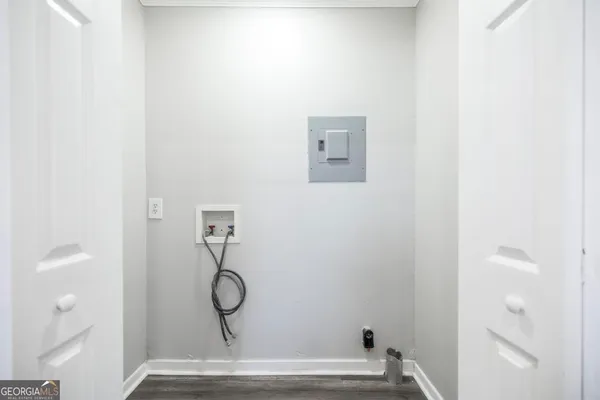 a view of door with wooden floor