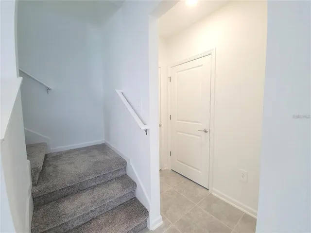 a view of a kitchen with a sink and cabinets