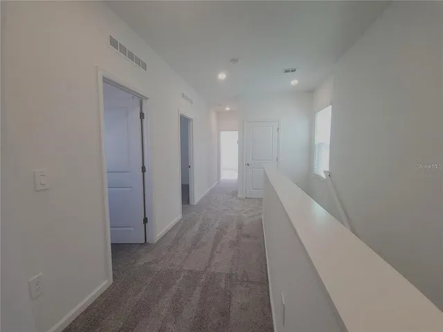 a bathroom with a sink toilet and window