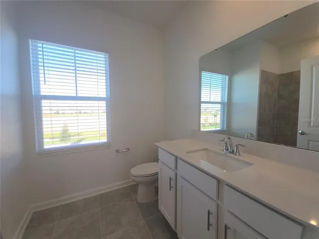 a view of a room with an empty space and hallway