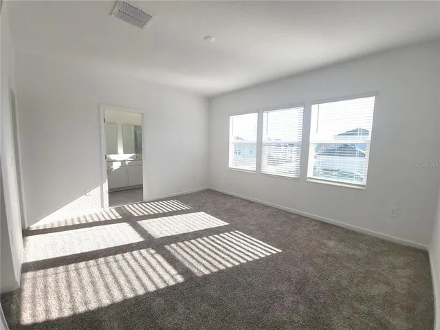 a bathroom with a shower sink and mirror