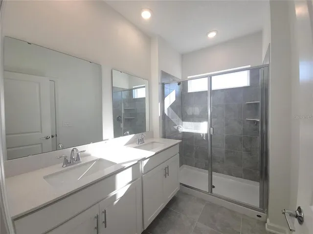 a view of swimming pool outdoor seating and city view