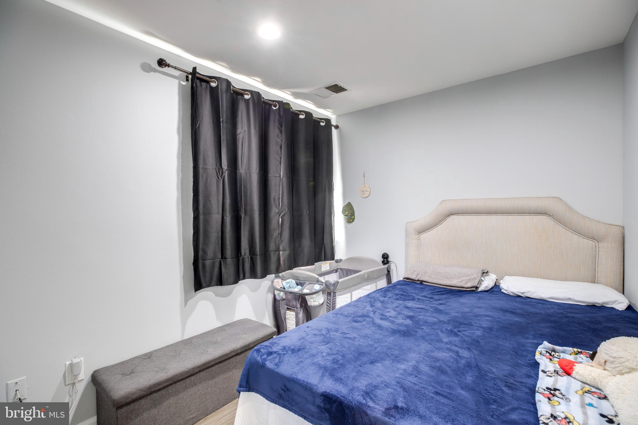 3382 Hewitt Avenue, Unit 102 Silver Spring, MD 20906 - Photo 10 of 22 a bedroom with a bed and a dresser