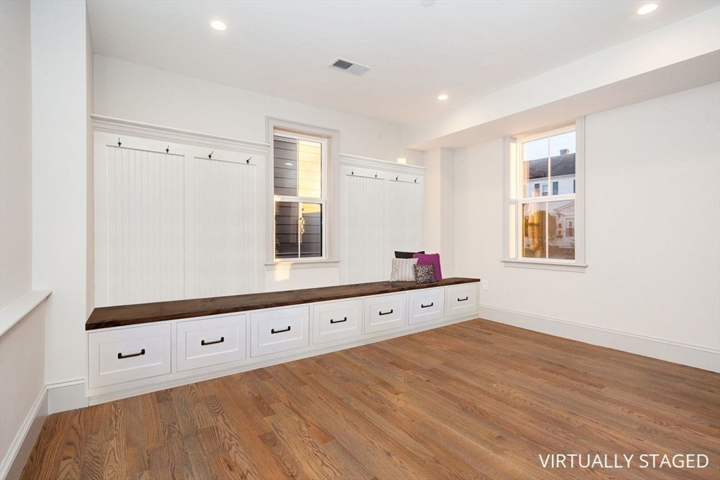 53 River Street, Unit 53 Boston, MA 02126 - Photo 14 of 25 a room with window and mirror