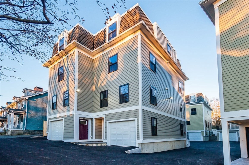 53 River Street, Unit 53 Boston, MA 02126 - Photo 20 of 25 a view of a house with a deck