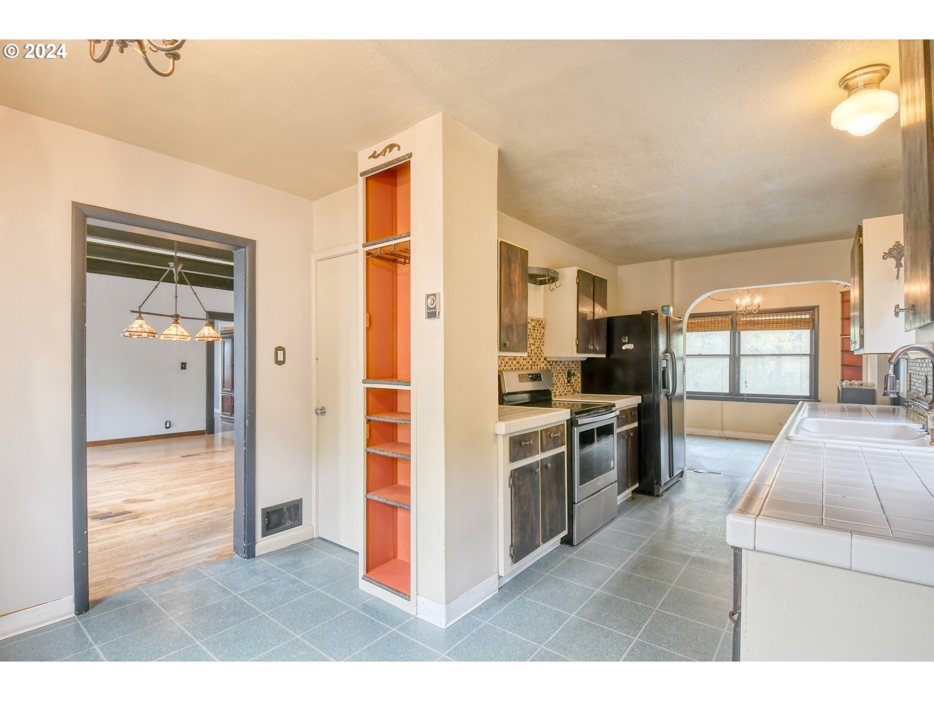 323 North Main Street Pendleton, OR 97801 - Photo 14 of 48 a kitchen with stainless steel appliances granite countertop a refrigerator and a sink