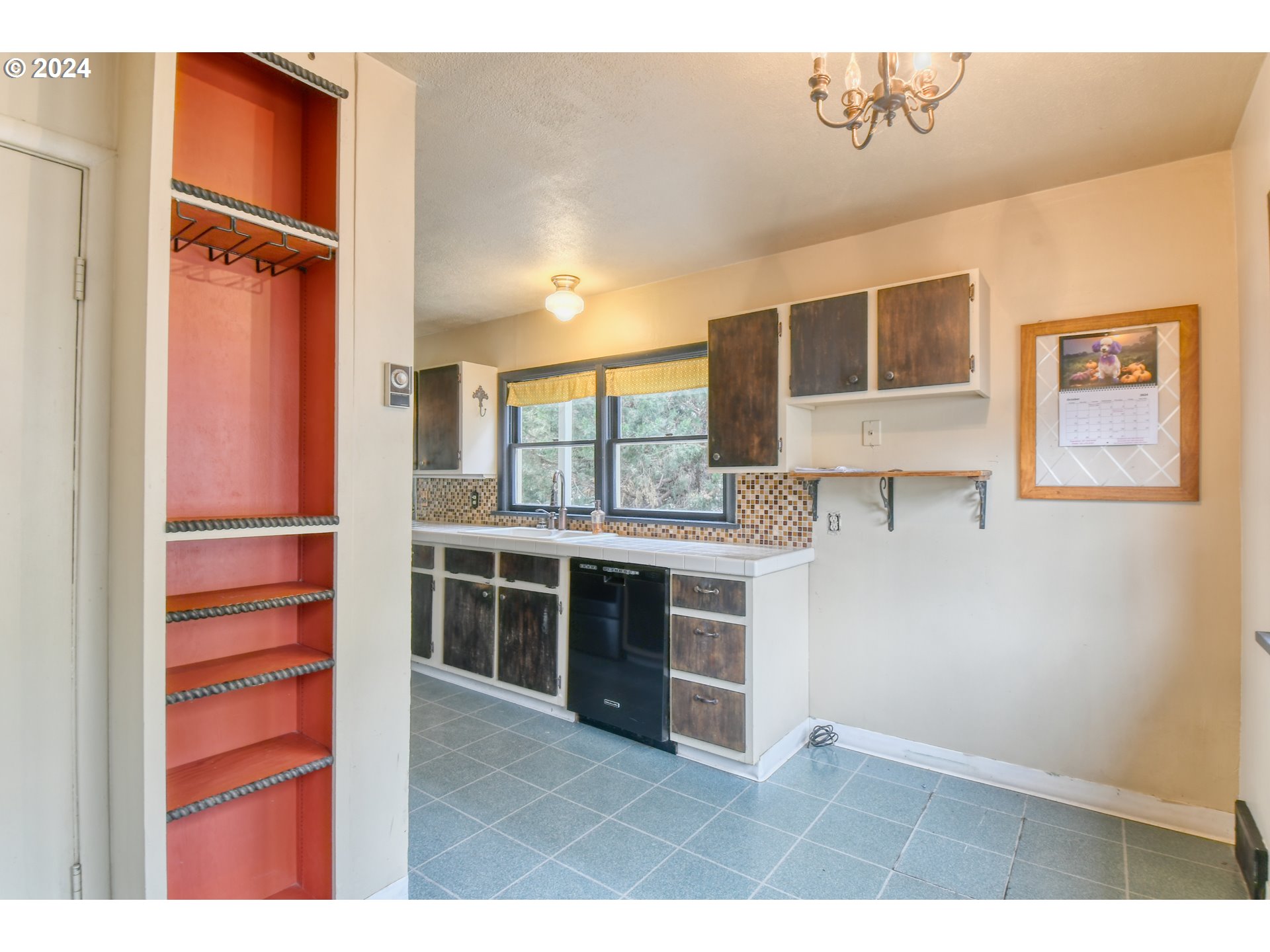 323 North Main Street Pendleton, OR 97801 - Photo 15 of 48 a kitchen with stainless steel appliances granite countertop a stove and a refrigerator
