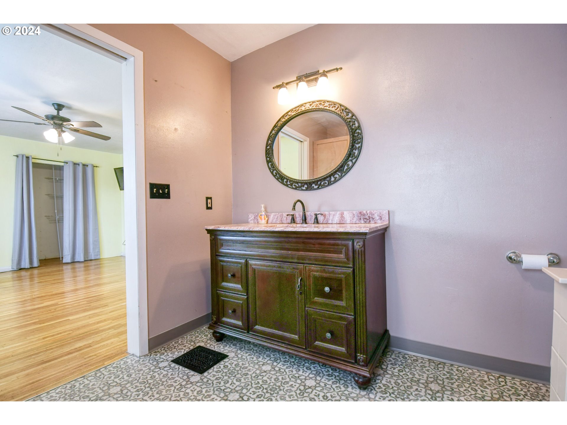 323 North Main Street Pendleton, OR 97801 - Photo 26 of 48 a bathroom with a sink a mirror and a toilet