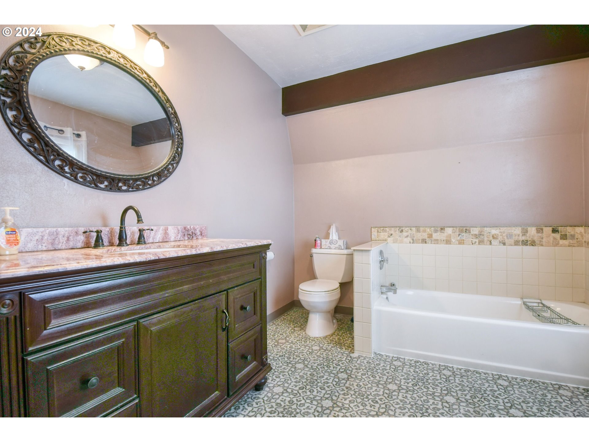 323 North Main Street Pendleton, OR 97801 - Photo 27 of 48 a bathroom with a toilet a sink and a mirror