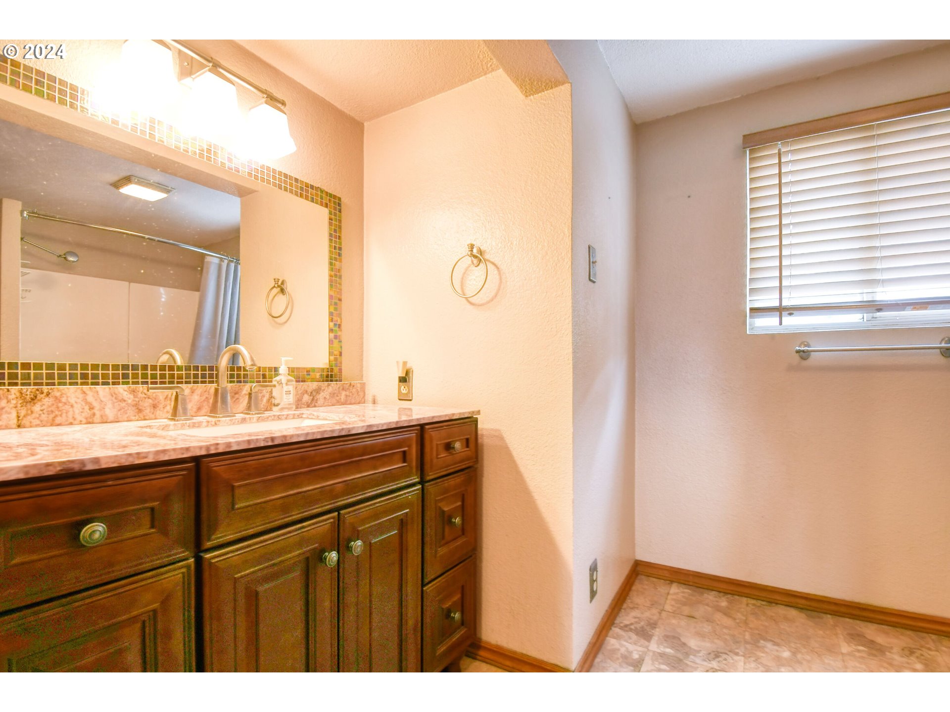 323 North Main Street Pendleton, OR 97801 - Photo 31 of 48 a view of bathroom with a sink a mirror and a window