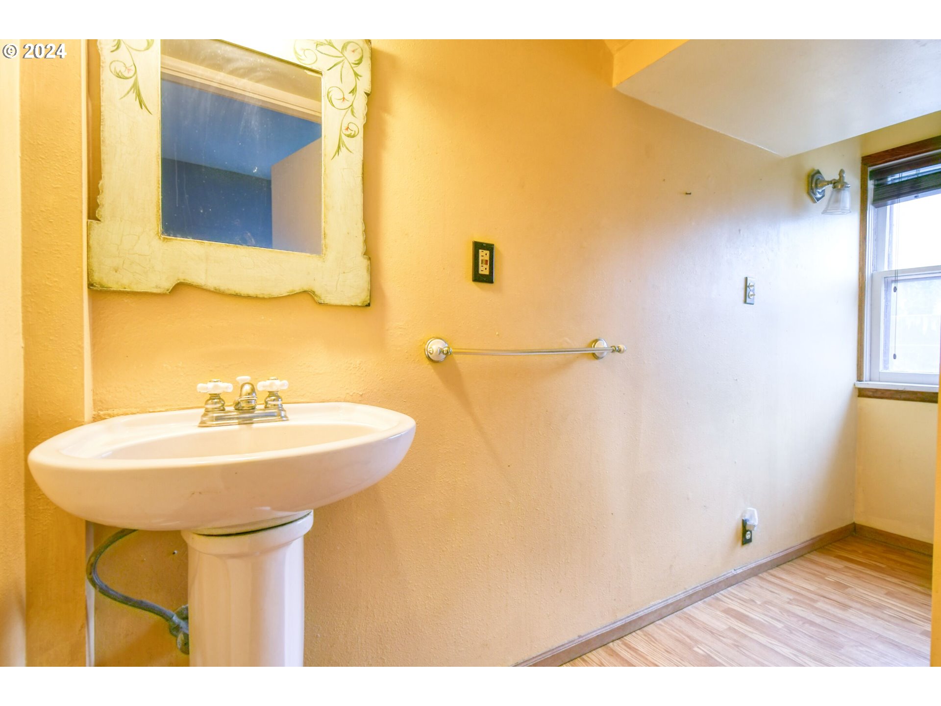 323 North Main Street Pendleton, OR 97801 - Photo 34 of 48 a bathroom with a sink and a mirror