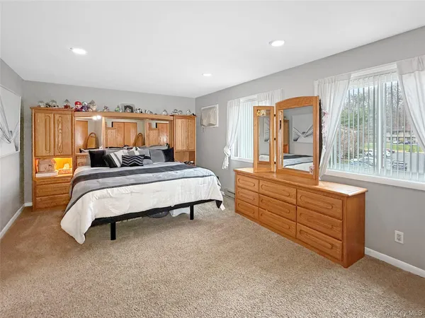 a bedroom with furniture and window