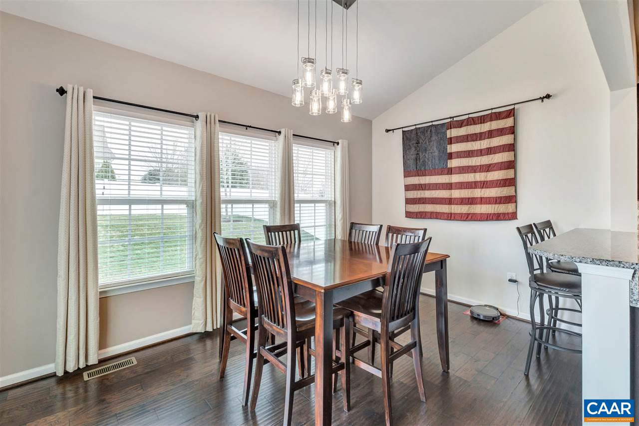 365 Ridgemont Road Ruckersville, VA 22968 - Photo 14 of 50 a view of a dining room with furniture window and wooden floor