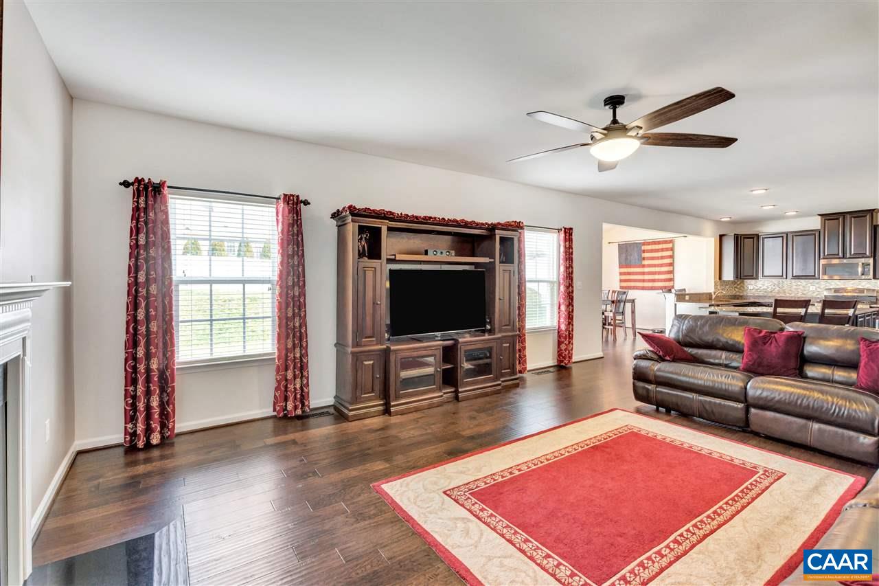 365 Ridgemont Road Ruckersville, VA 22968 - Photo 15 of 50 a living room with furniture and a flat screen tv